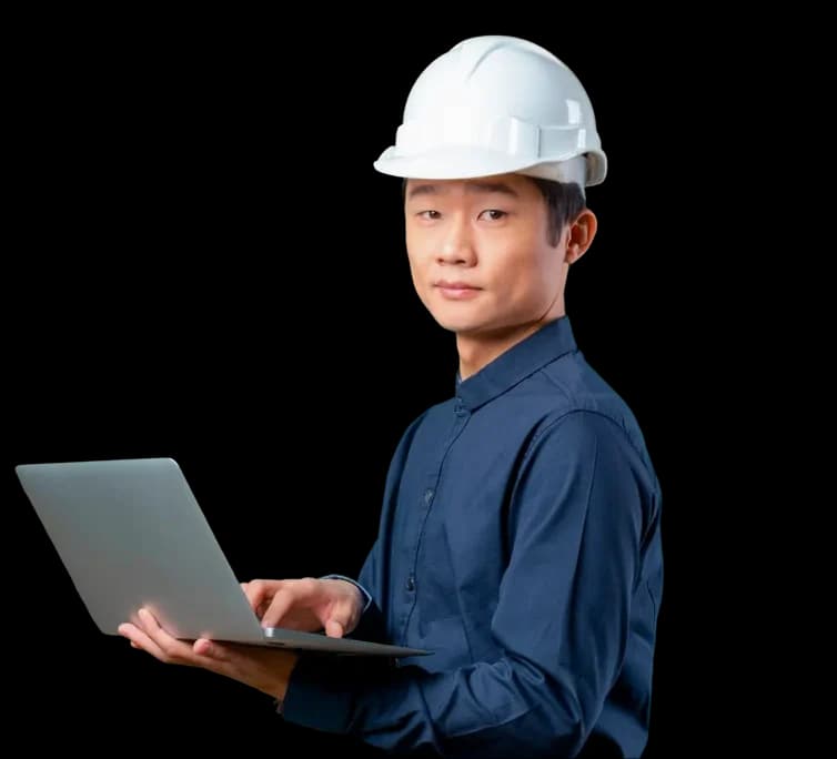 Factory engineer reviewing shift data on a laptop